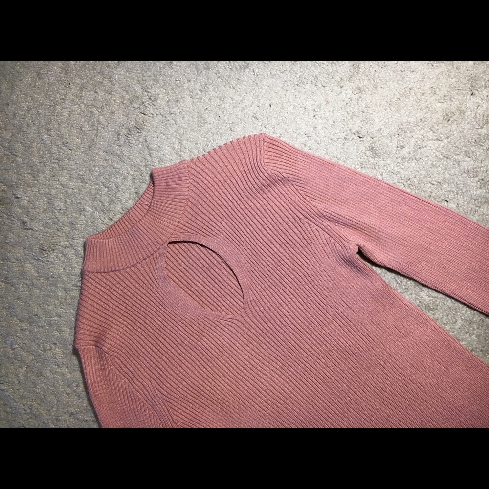 peachy-pink turtleneck shirt